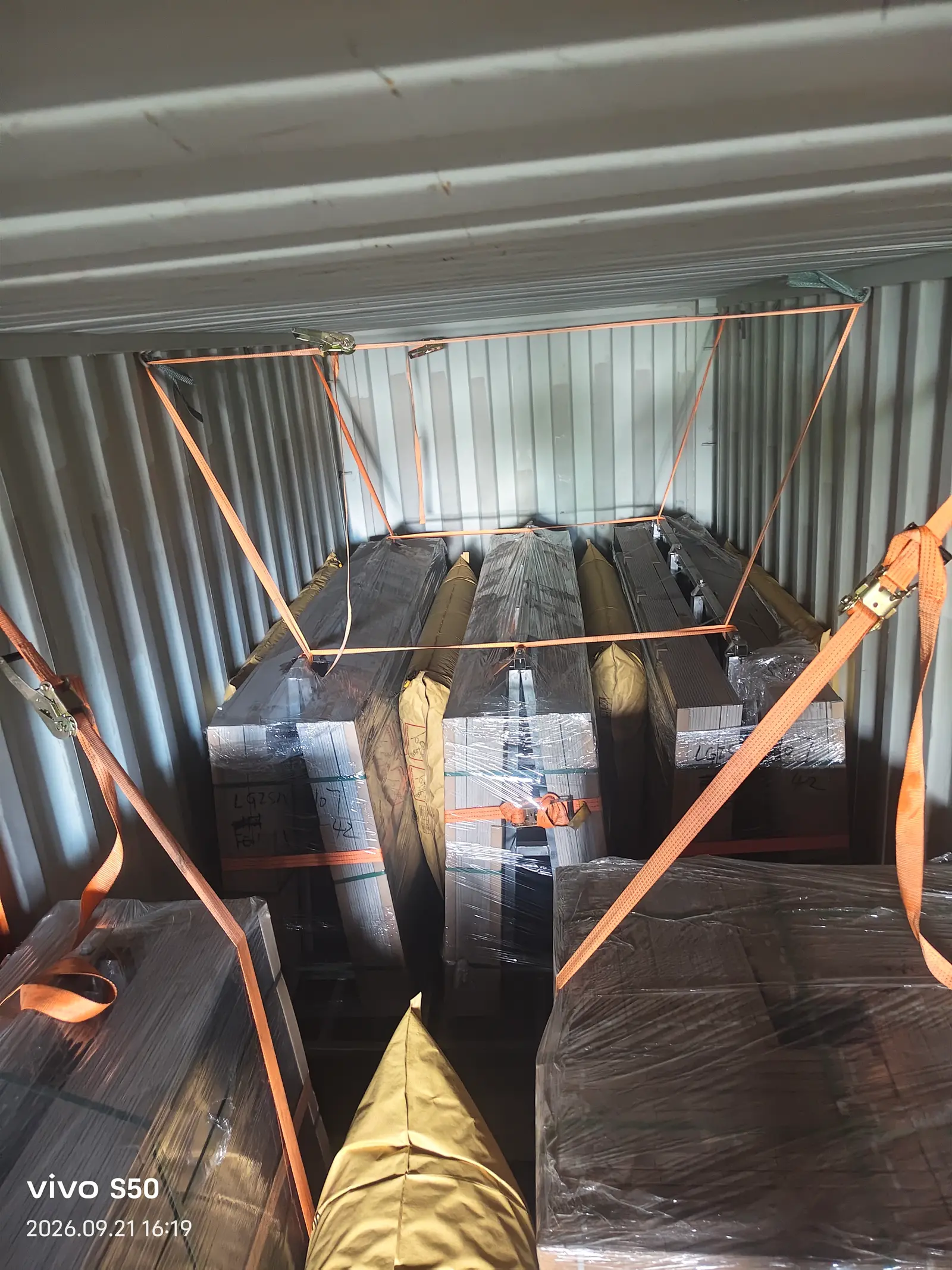 Stone slabs secured on A-frames inside a 20ft container